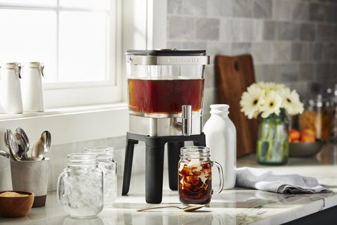 KitchenAid brewer next to mug shows compact size and kitchen scale