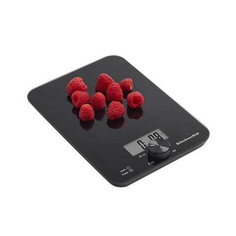 KitchenAid size comparison with hand illustrates compact design and kitchen counter fit