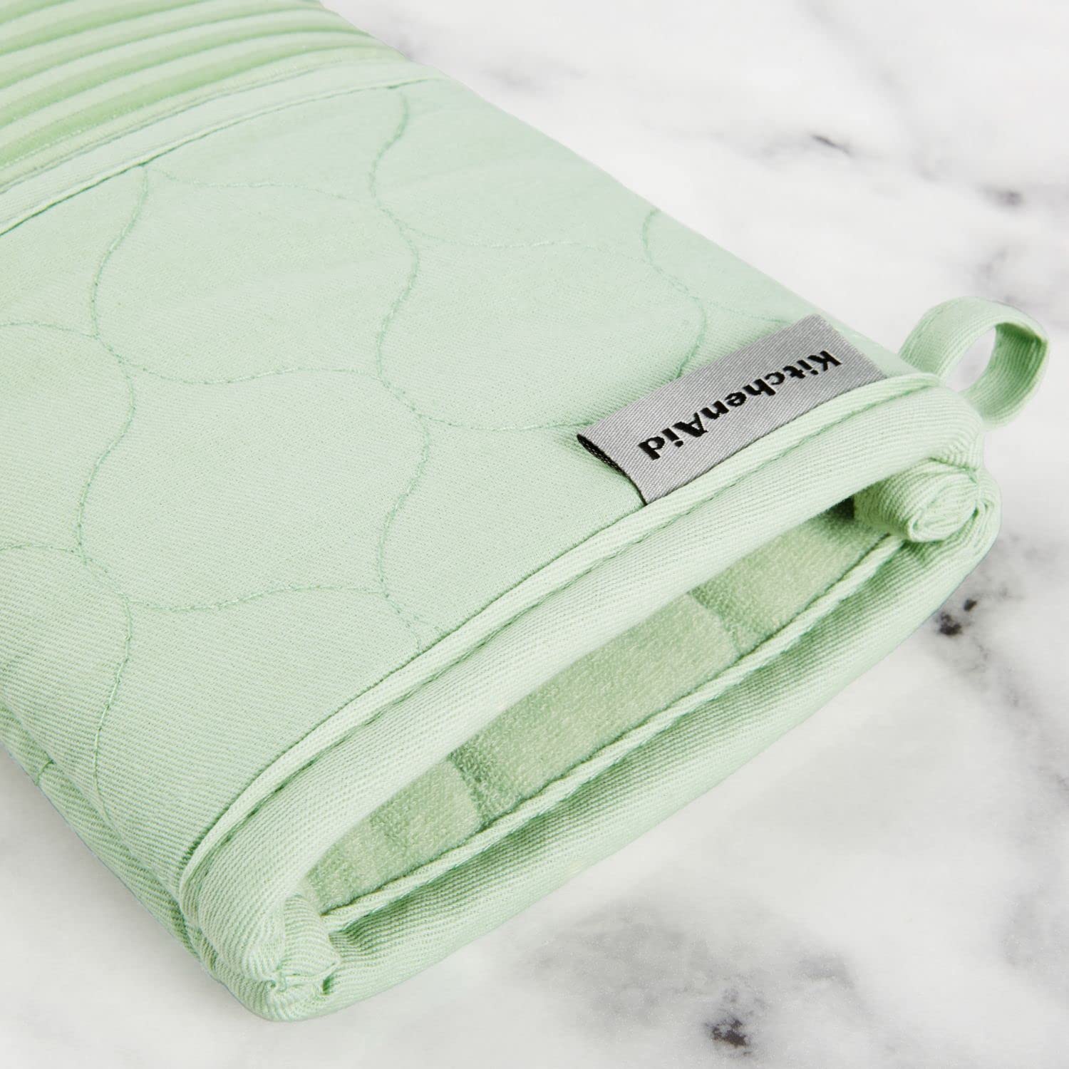 KitchenAid kitchen towel absorbing spilled liquid quickly to prevent messes