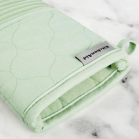 KitchenAid kitchen towel absorbing spilled liquid quickly to prevent messes