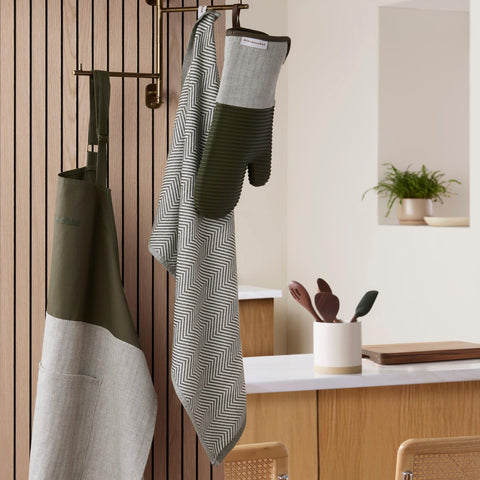 KitchenAid towel soaking up an accidental counter spill for quick cleanup