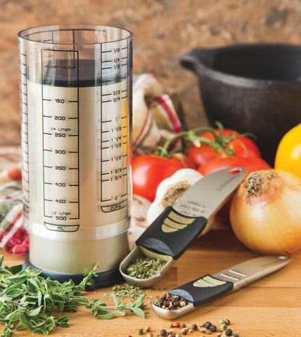 KitchenArt 2-cup Adjust-A-Cup beside standard cup showing space-saving versatility