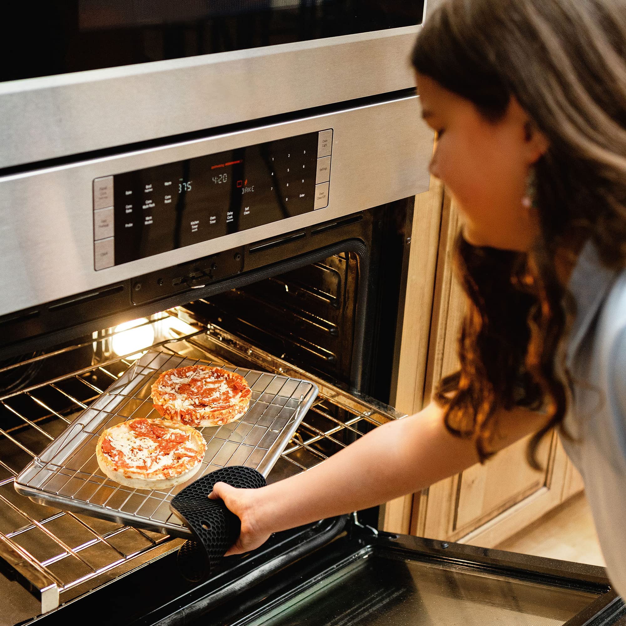 KITCHENATICS rack beside a standard sheet pan showing size fit and scale advantage