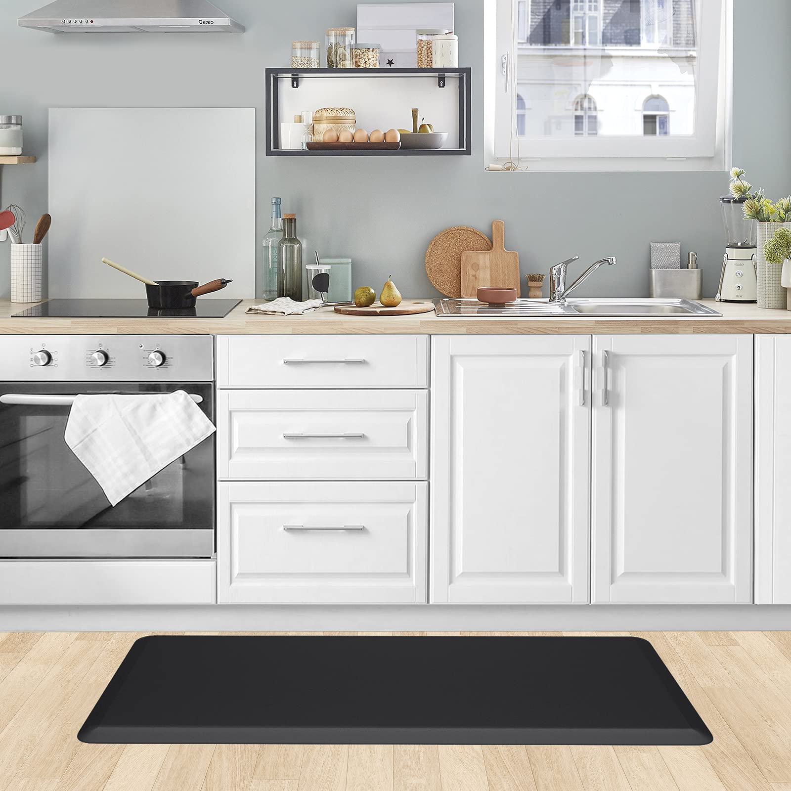 KitchenClouds mat being wiped clean demonstrating easy maintenance