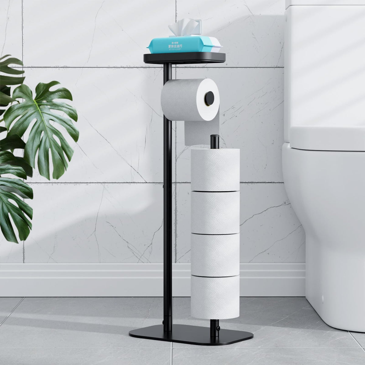 Kitsure front view of free-standing black toilet paper holder showing single roll and stored backups, neat storage benefit