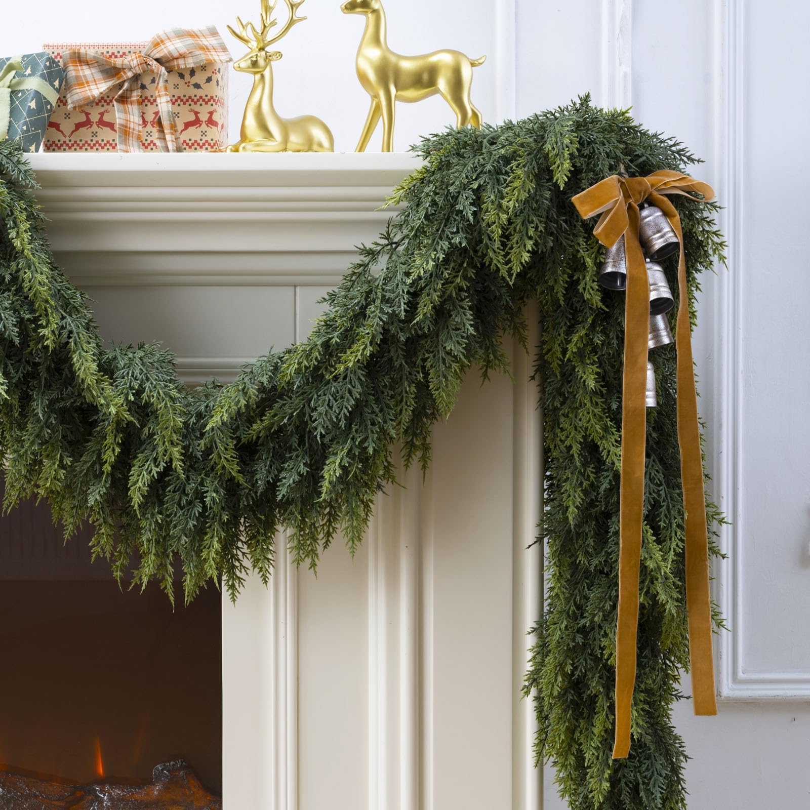 KIWDY garland on covered porch adding durable greenery and welcoming entrance charm