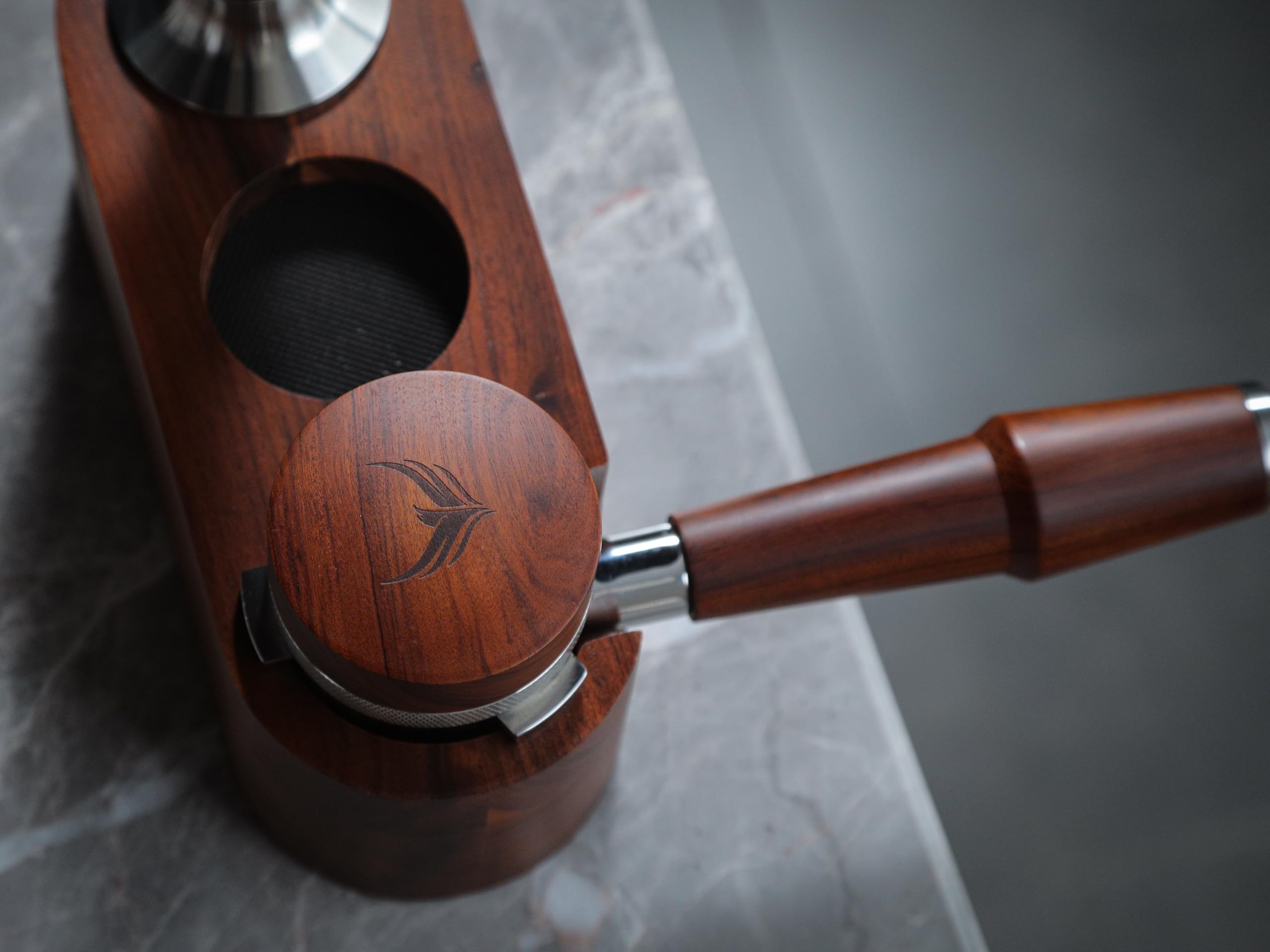 KNODOS on a barista station near tamper and knock box for complete workflow