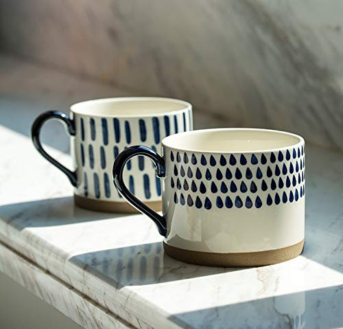 Koja stacked mugs in cabinet showing space-saving storage advantage