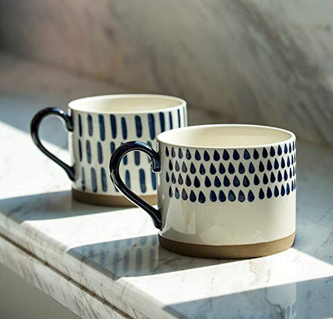 Koja stacked mugs in cabinet showing space-saving storage advantage