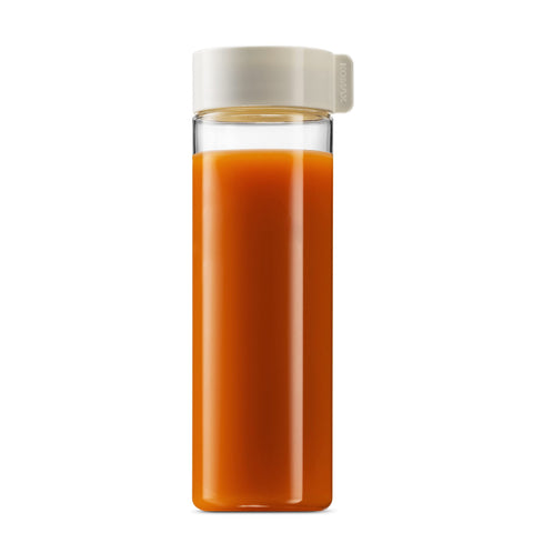 Komax smoothie on kitchen counter showing lifestyle use and convenient serving benefit