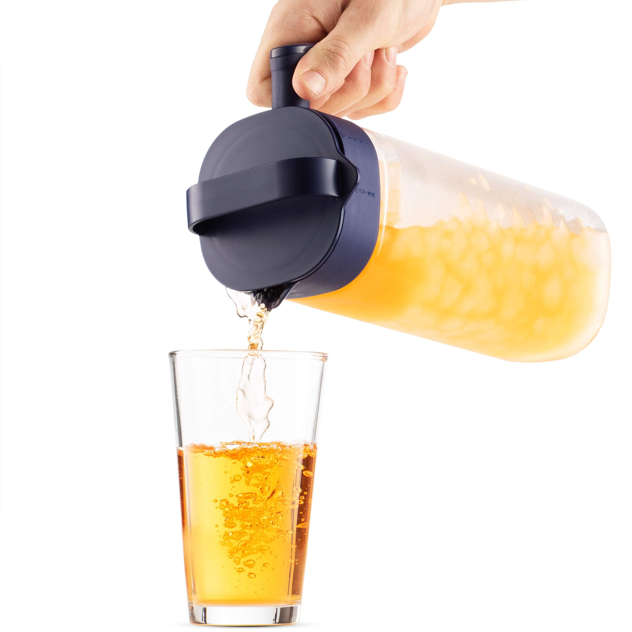 Komax pitcher filled with iced tea and fruit showing visual appeal and chilling benefit