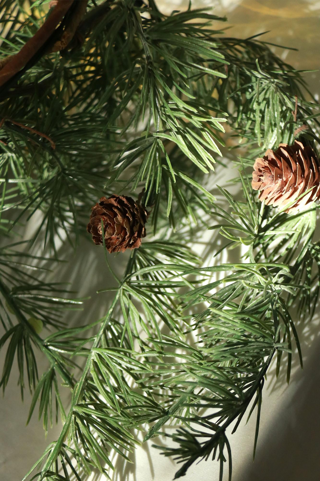 Konosnd garland beside hands showing 6ft scale for fitting spaces
