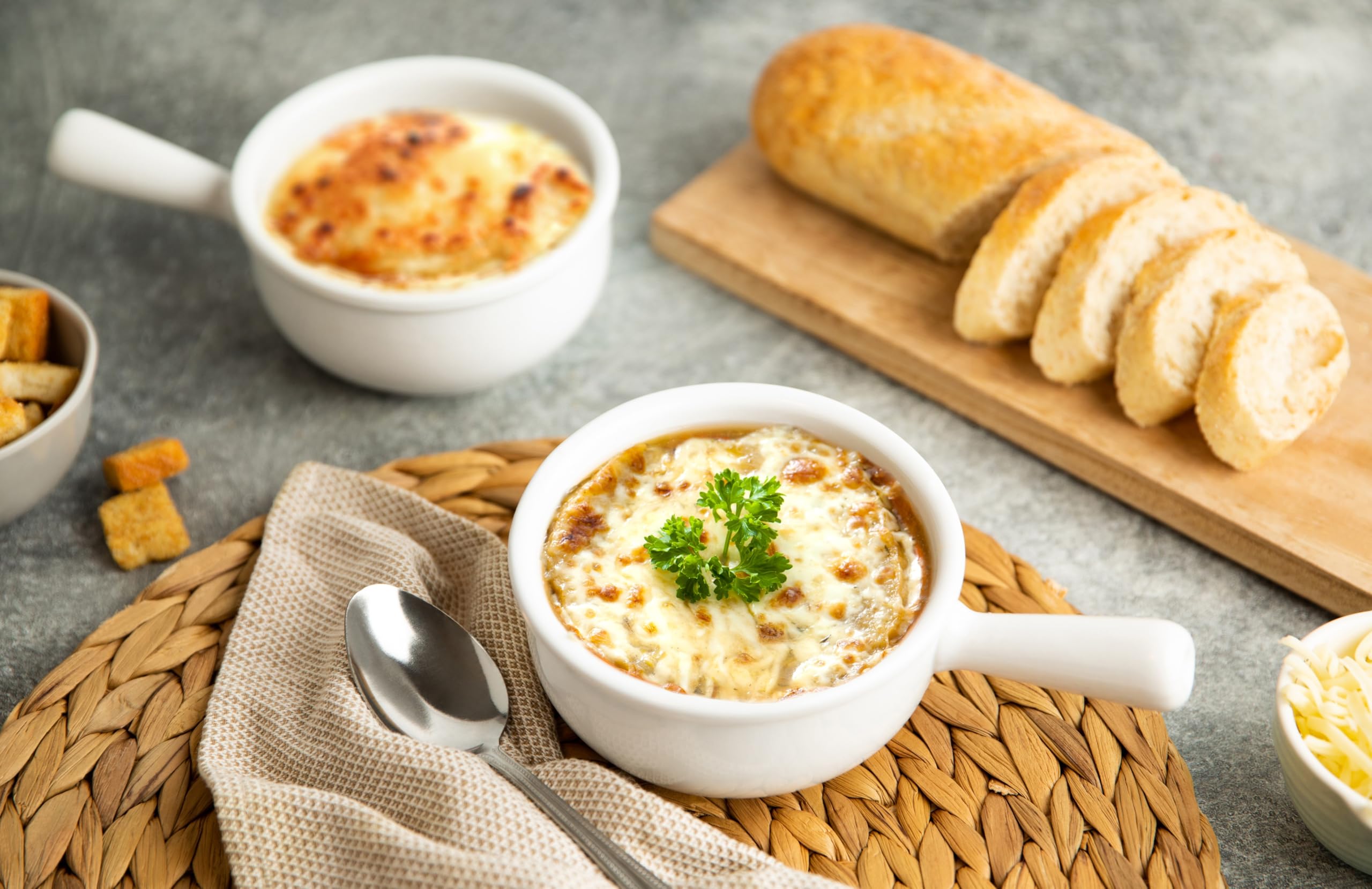 KooK crock with melted cheese on top demonstrating oven-to-table serving