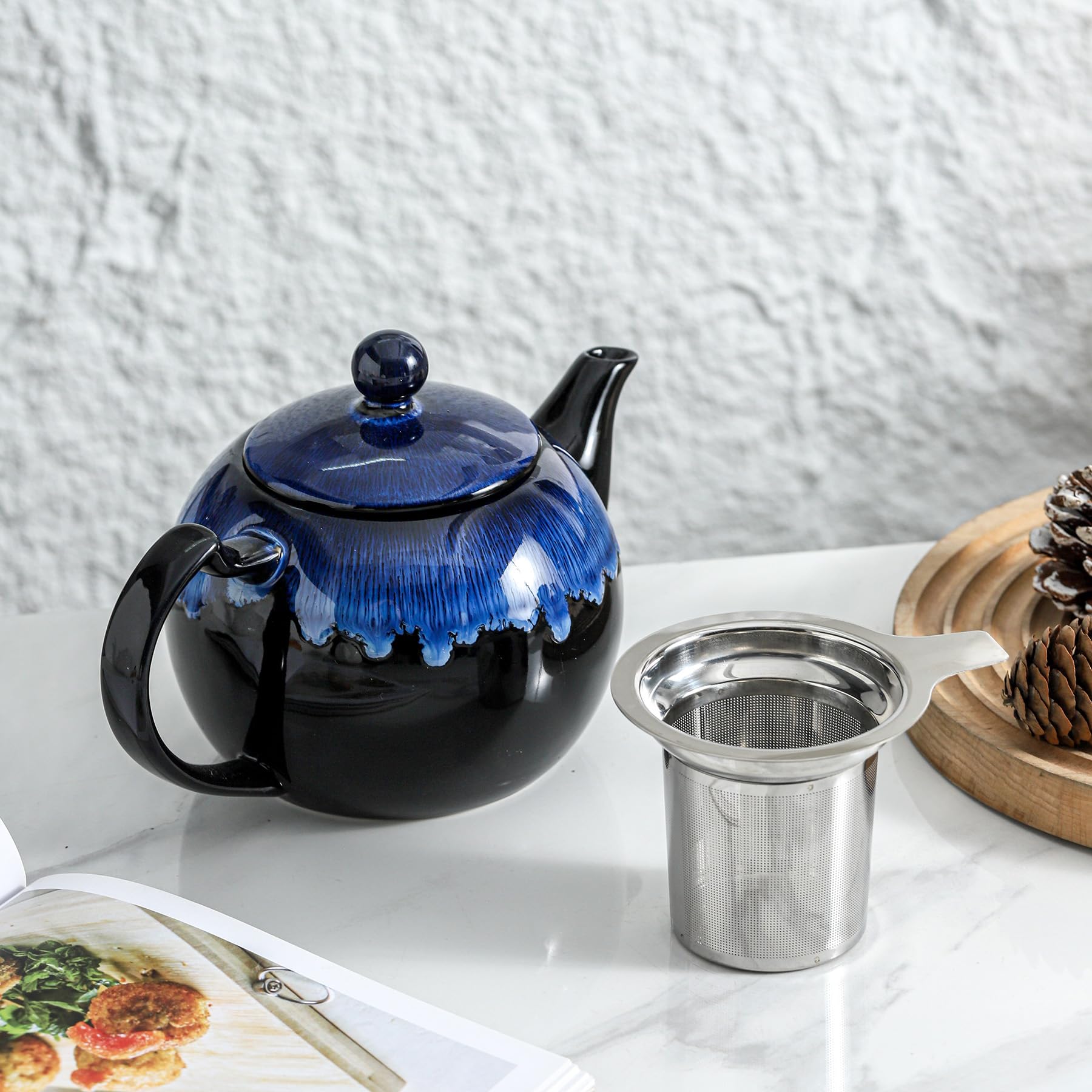 KOOV teapot beside teacups to show 34oz capacity and serving scale