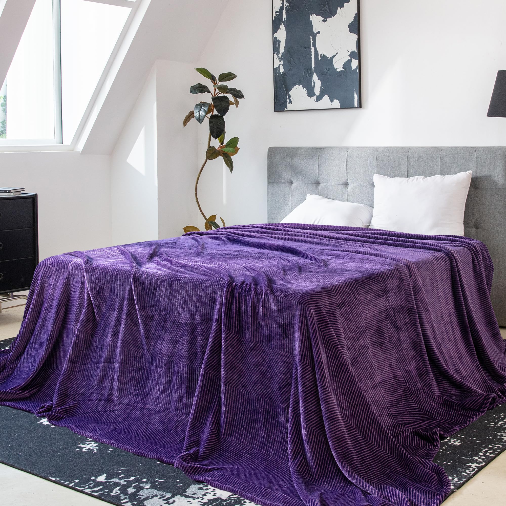 KORBLISS folded blanket on bed demonstrates 120x120 size and scale