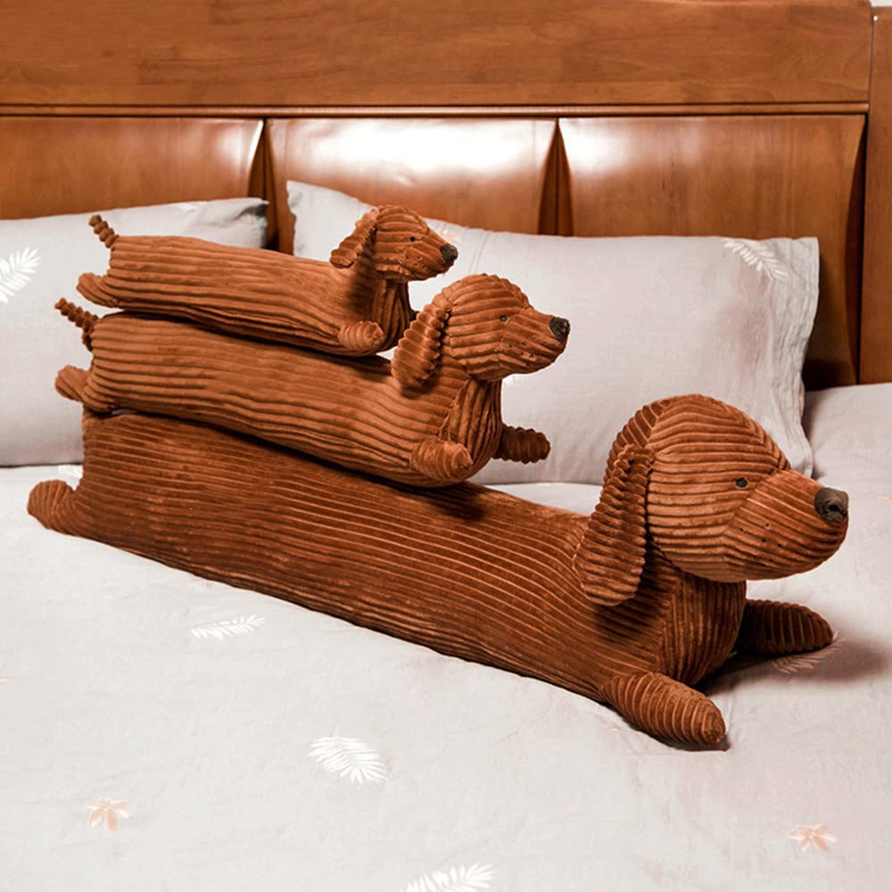 KOWAKA child hugging dachshund pillow demonstrating cozy companionship