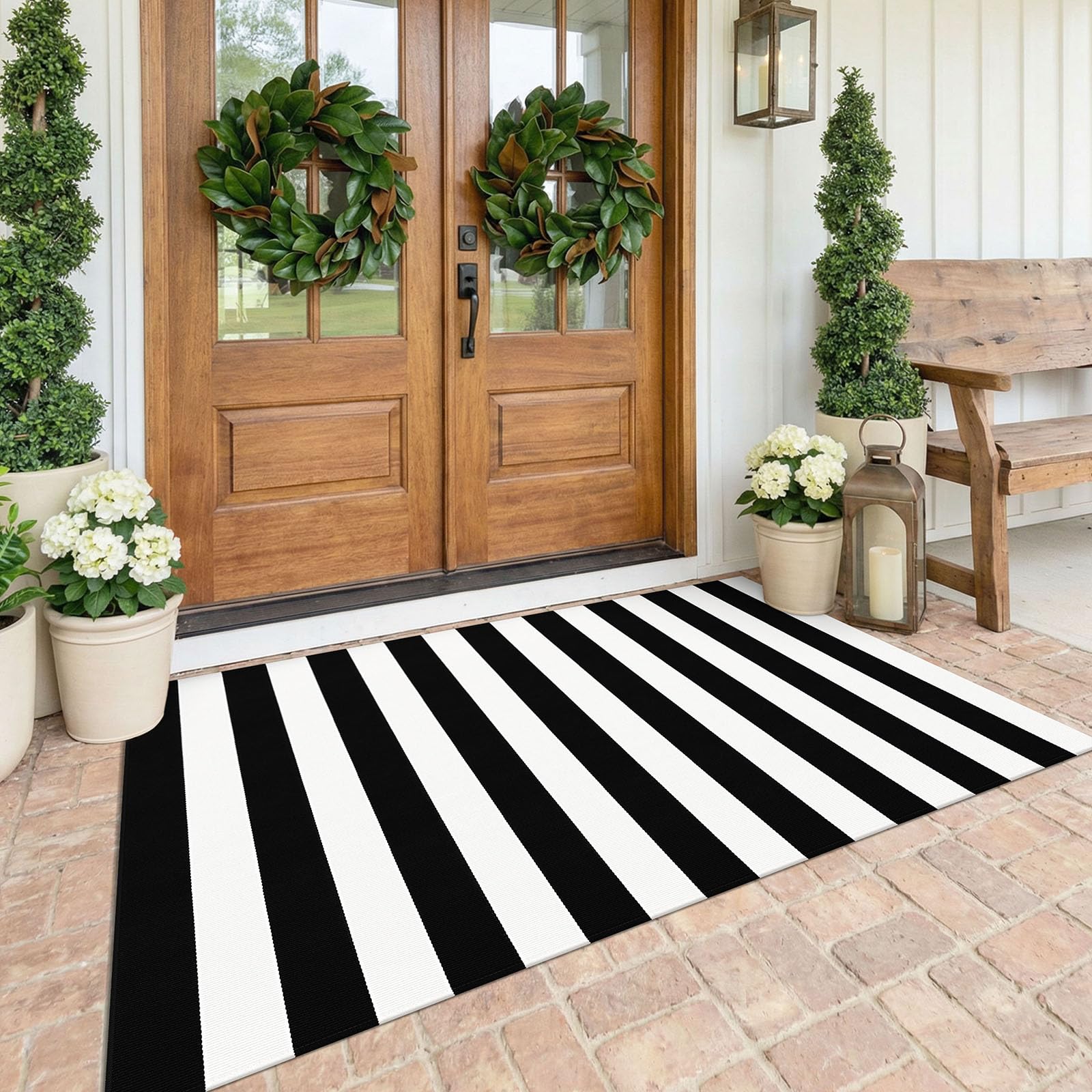 KOZYFLY front view of black and white outdoor rug showing bold pattern and curb appeal