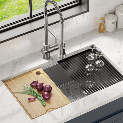 Kraus Kore board placed over sink demonstrating elevated prep area