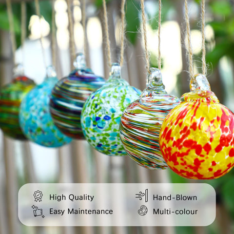 KRISININE ornament hung on Christmas tree catching light for festive sparkle