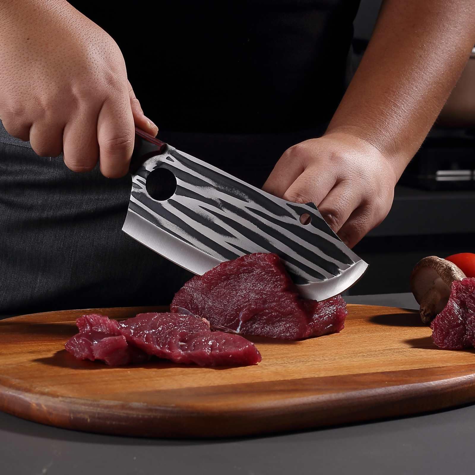 Krononidler knife next to hand for scale illustrating comfortable ergonomic balance