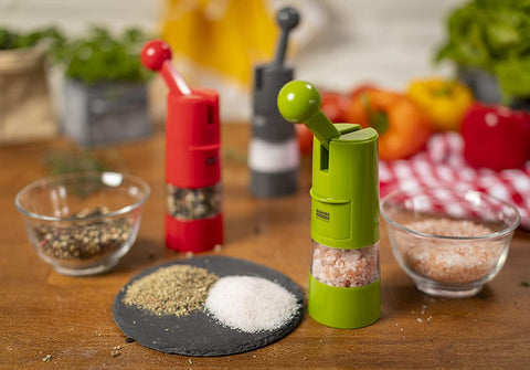 Kuhn Rikon grinder filled with peppercorns and salt showing visible contents for refills