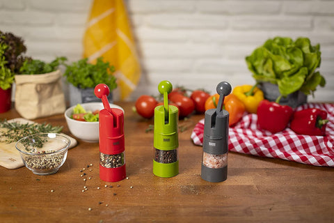 Kuhn Rikon grinder held in hand showing 8.5 by 2.25-inch scale for space-saving storage