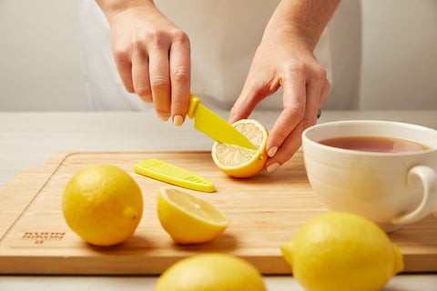 Kuhn Rikon paring knife in use peeling an apple for precise small prep