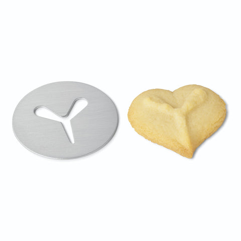 Kuhn Rikon cookie press extruding dough onto a baking sheet efficiently