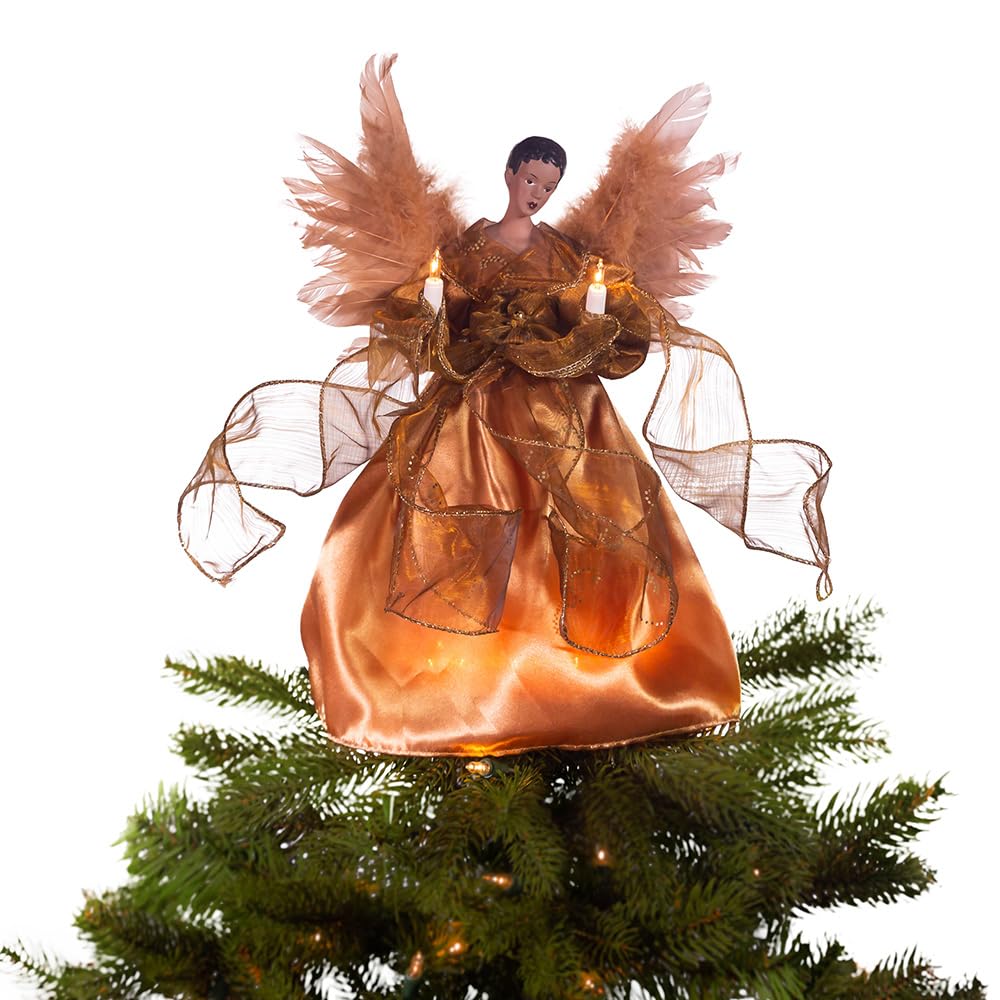 Kurt Adler angel placed on tree lit with ten lights showing warm glow