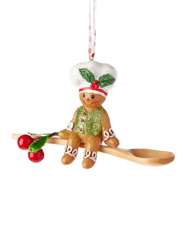 Kurt Adler ornament beside a hand for scale showing 4-inch size and easy placement
