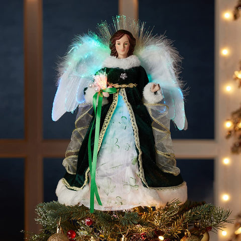 Kurt S. Adler close detail of green gown and feather trim highlighting craftsmanship