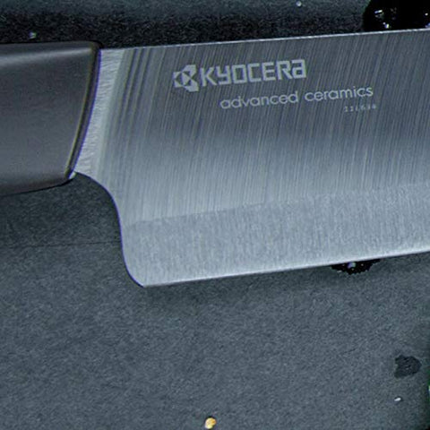 KYOCERA packaging and contents laid out to show included sizes and care notes