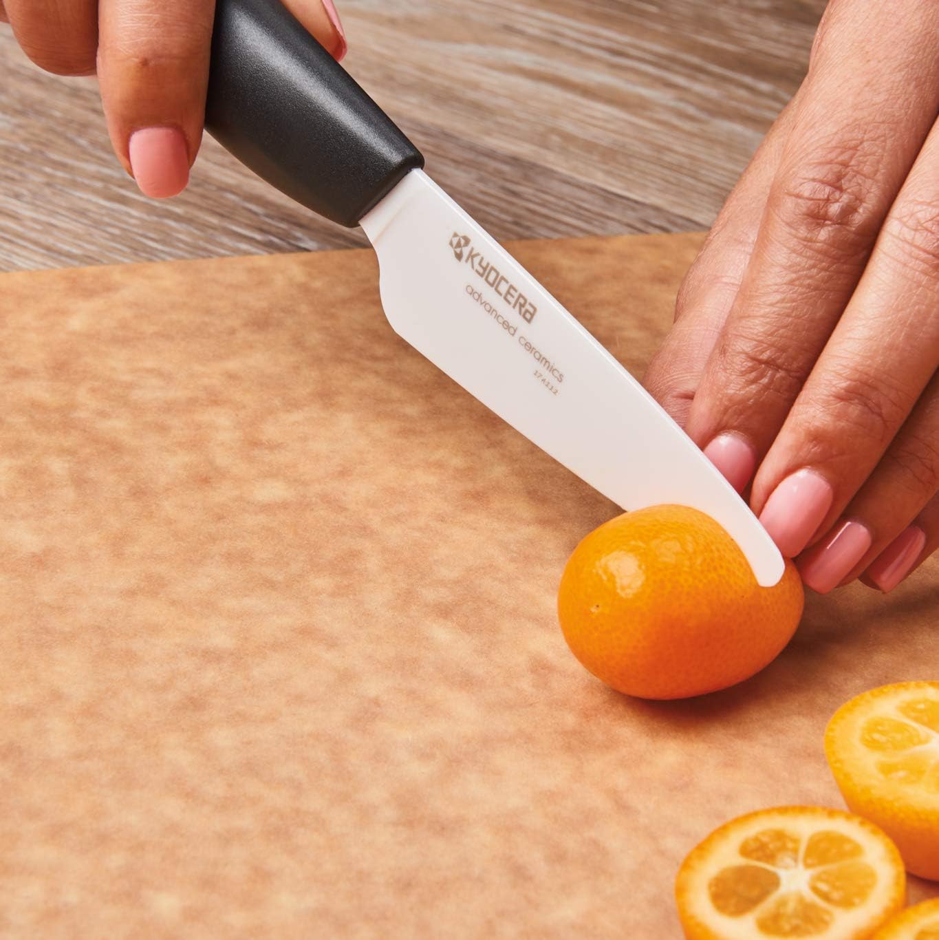 KYOCERA blades resting on cutting board illustrating clean non-reactive surface