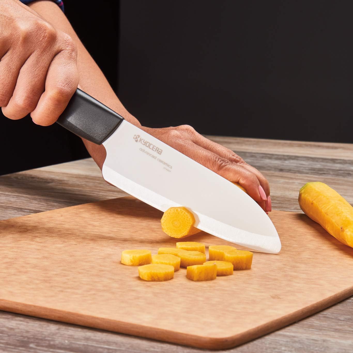 KYOCERA chef's santoku slicing vegetables highlighting smooth, even cuts