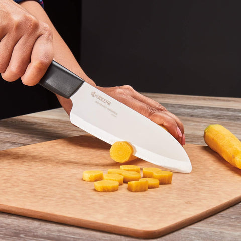 KYOCERA chef's santoku slicing vegetables highlighting smooth, even cuts