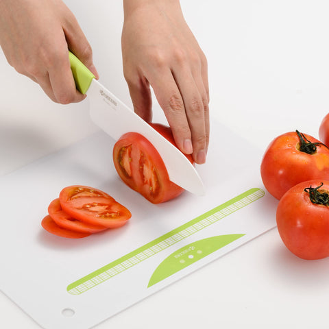 KYOCERA knives held in a hand to show compact size and lightweight benefit