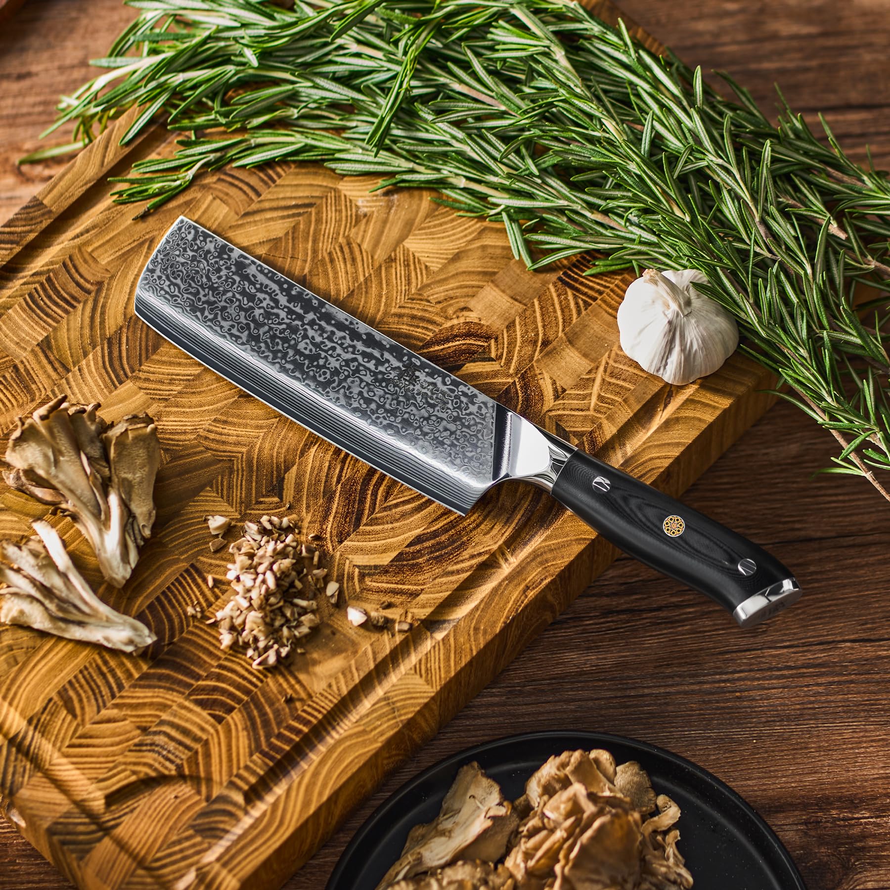 KYOKU scale comparison with hand holding knife for size perspective and balance