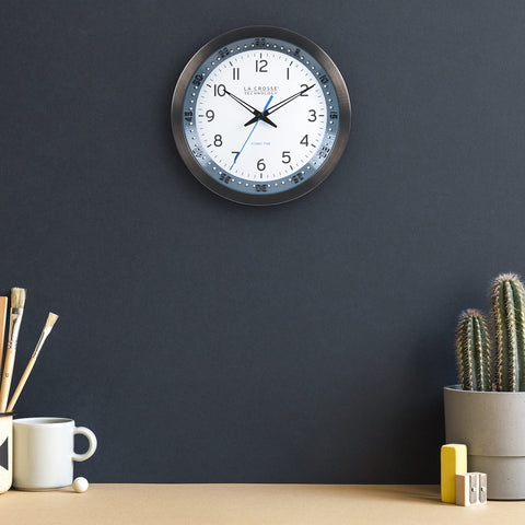 La Crosse Technology clock next to ruler showing 10-inch diameter for scale