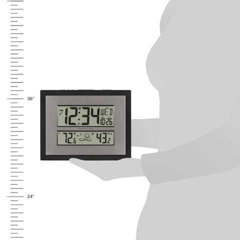 La Crosse Technology size comparison with hand to show compact footprint and visibility