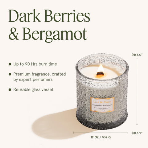 LA JOLIE MUSE candle held in hand showing 19 oz scale and long burn benefit