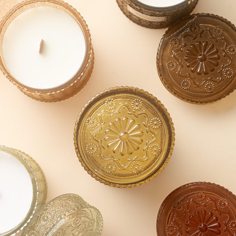 LA JOLIE MUSE candle lit in a cozy living room setting creating warm atmosphere