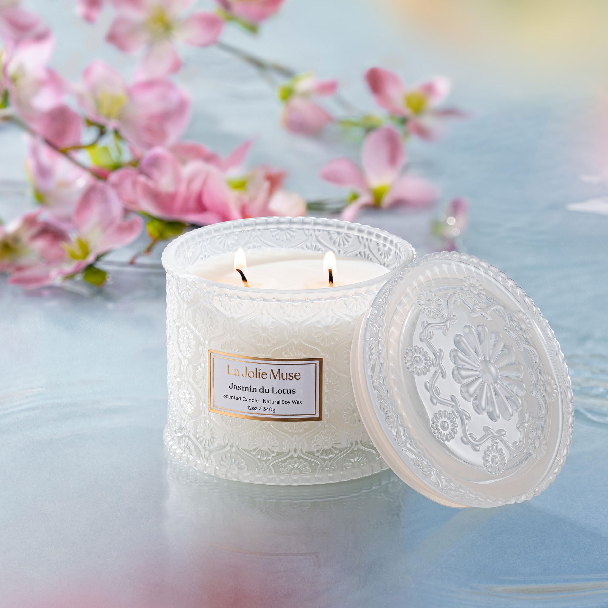LA JOLIE MUSE candle lit with two wicks creating even glow and steady fragrance throw benefit