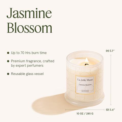 LA JOLIE MUSE candle next to a coffee mug demonstrating 10oz scale and long lasting burn advantage