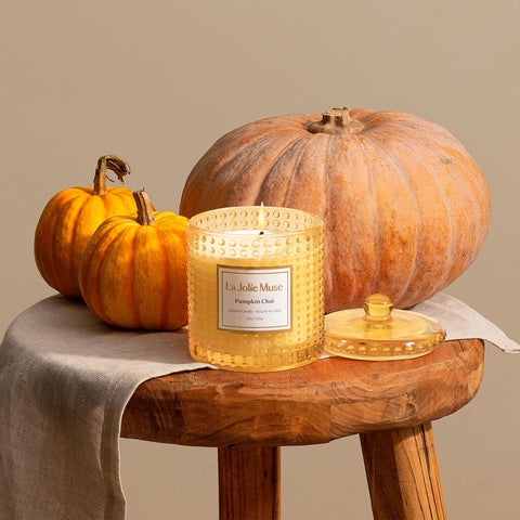 LA JOLIE MUSE lit candle in living room creates cozy ambience