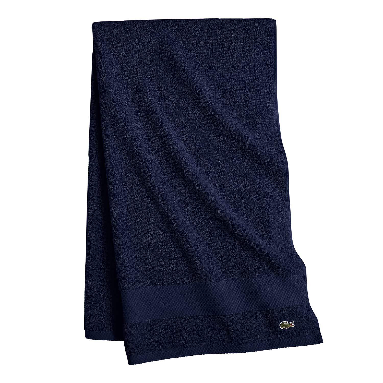 Lacoste pique border detail highlighting neat hem and tailored finish
