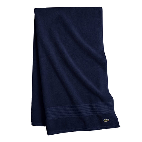 Lacoste pique border detail highlighting neat hem and tailored finish