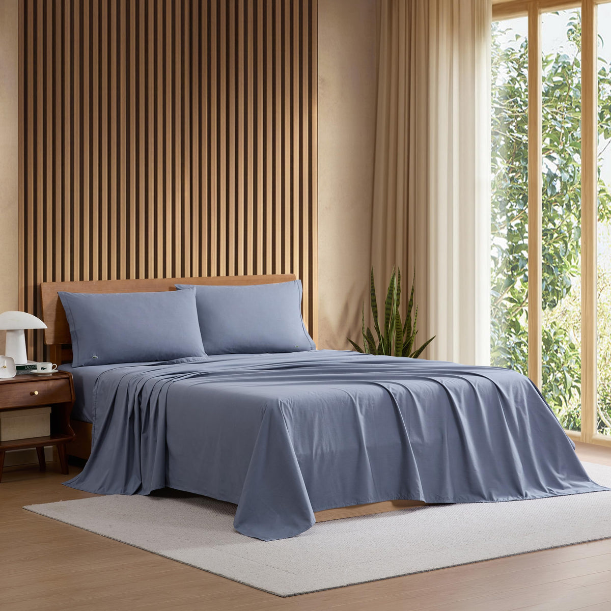 Lacoste flat sheet front view showing clean Vintage Indigo colour and benefit: polished look