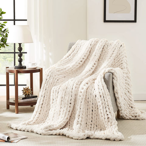 L'AGRATY front view of ivory chunky knit throw showing cozy look