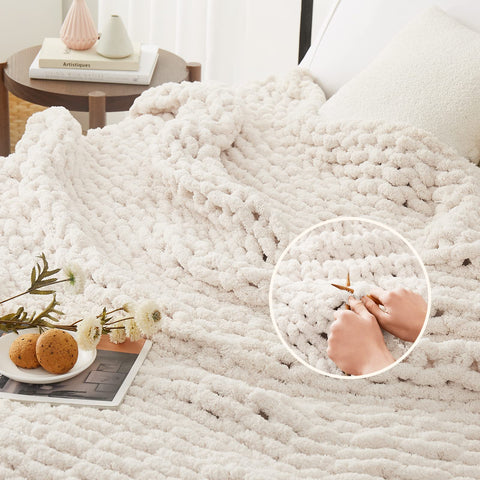 L'AGRATY throw on couch lifestyle shot showing warm styling benefit