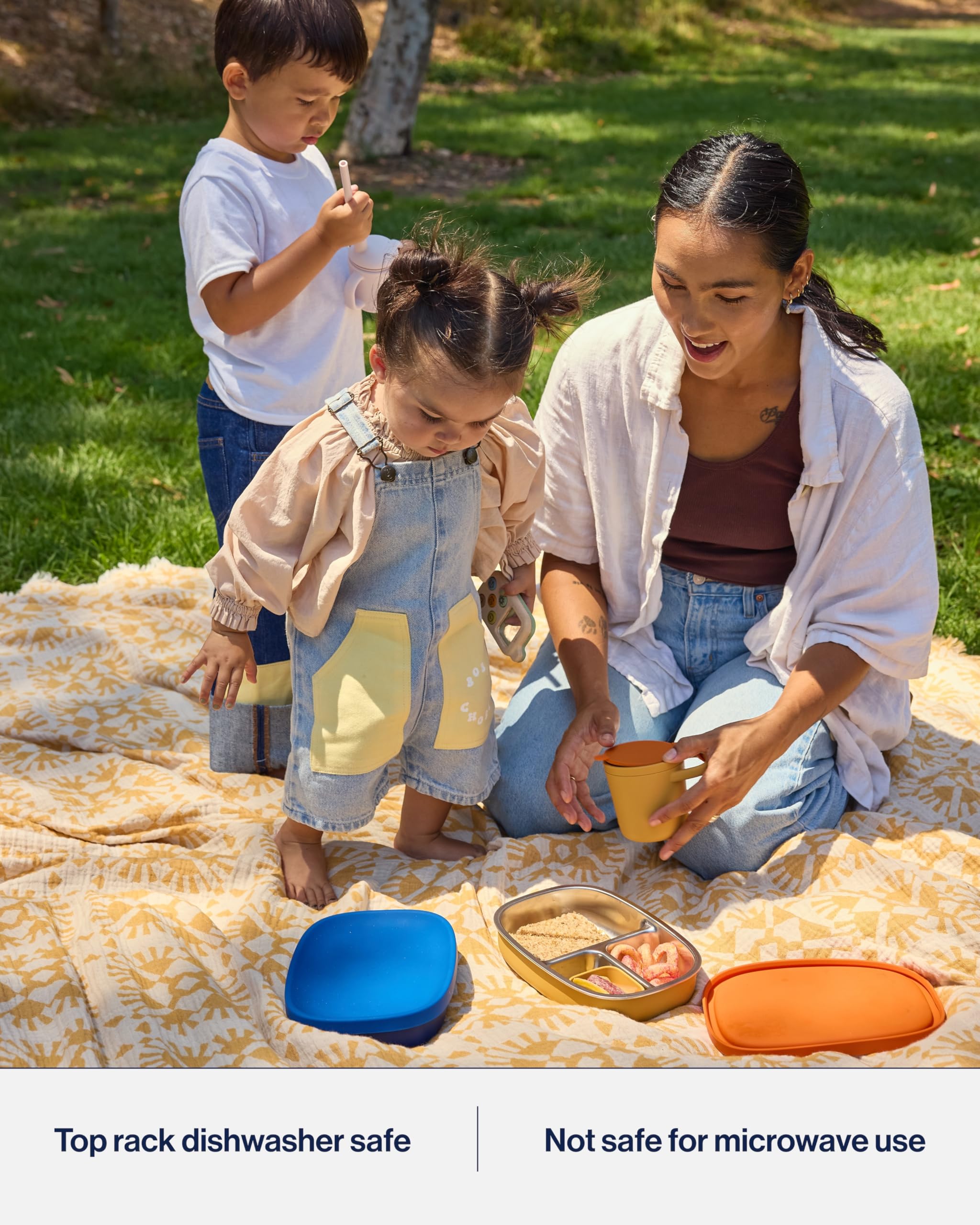 Lalo bento box beside a sippy cup showing size and fit for backpacks